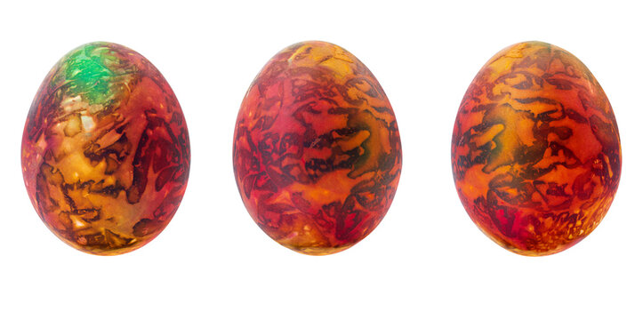 Collection of abstract orange - brown - green drawings on painted eggs. Easter concept, fantasy animal eggs. Copy space