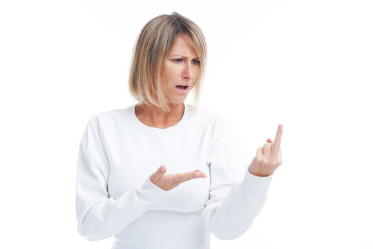Picture of blonde woman showing middle finger isolated over white background