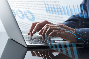 Business financial reports. Business person using laptop for writing documents. Close up of hands...