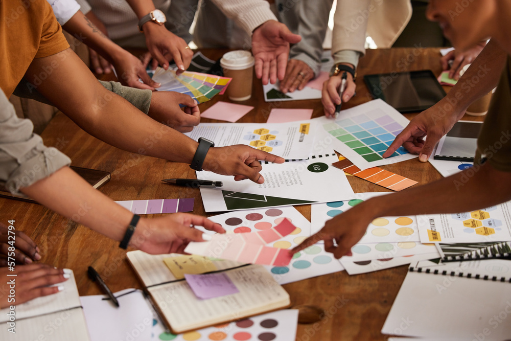 Poster creative, hands and color palette on table in meeting for planning, brainstorming or design strategy