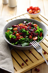 Rocca, beetroot, cherry tomato and pomegranate salad
