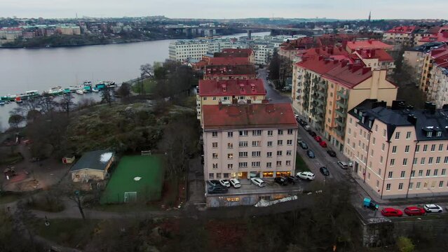 Orbiting aerial over apartment buildings on Stockholm island Stora Essingen