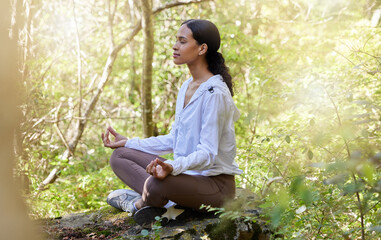Zen, meditation and woman in nature or forest calm in peace, spiritual and doing yoga for awareness and faith. Mindful, woods and female person relax in green trees for wellness and health lifestyle