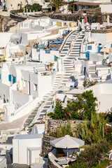 Fototapeta premium Domes, steeples, bells and white buildings of Santorini, Greece 