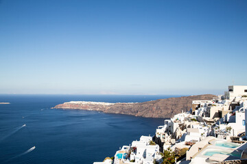 Obraz premium Domes, steeples, bells and white buildings of Santorini, Greece 