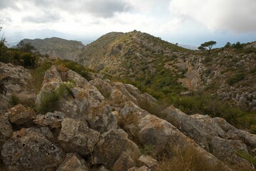 View of Montgó mountain in Spain with its cliffy, green surroundings overlooking the valley of Oliva.