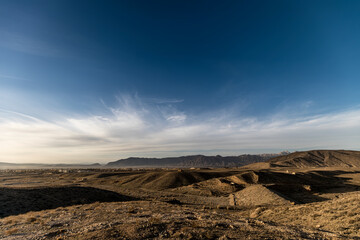 Fototapeta na wymiar Arid land in the mountains, clouds with blue sky, Quetta Valley 