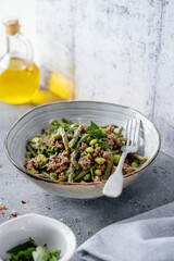 Green beans with minced meat in bowl