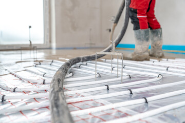 installation of liquid concrete on the floor for underfloor heating