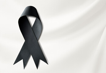 funeral ribbon on silk background