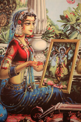 Painting depicting Radha looking at a picture of Krishna. India.
