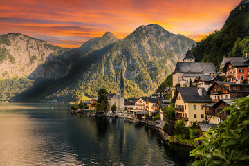 Fototapeta premium Hallstatt town with reflection in lake with sunset sky, Austria