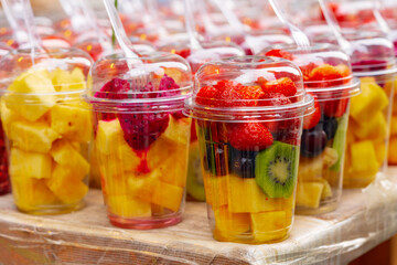 Fototapeta na wymiar Fresh fruits on showcase at a farmers market