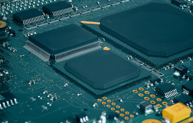 Closeup of Printed Circuit Board with processor, integrated circuits and many other surface mounted...