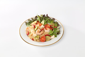 Instant noodles, seafood salad, and vegetables in a white dish.