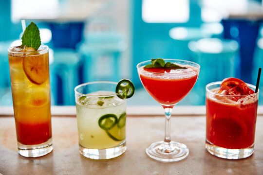 Four Colorful cocktails on bar