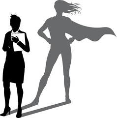A superhero business woman revealed by her shadow silhouette as a super hero in a cape © Christos Georghiou