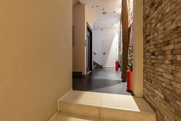 Hotel corridor interior with brick wall decoration