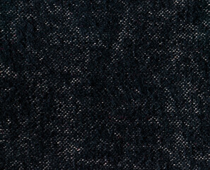 The texture of the fabric of the old blanket. black fabric duvet.