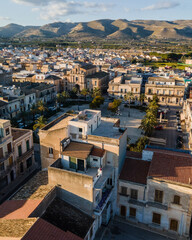 Italy, Sicily, Avola, Square in middle of residential district with hills in background
