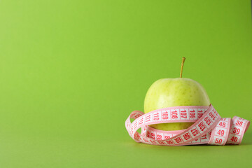Diet and weight loss, healthy lifestyle, composition with measuring tape, space for text