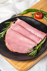 Beef salami slice in plate. Dried smoked ribeye salami. close up