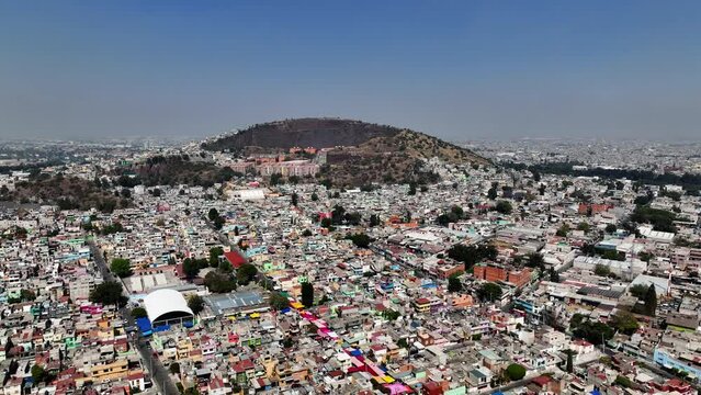 Aerial view circling around a Tianguis and a poverty area in Iztapalapa, CDMX