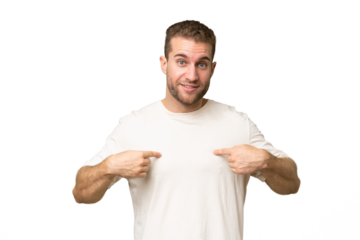 Young handsome caucasian man isolated on green chroma background pointing to oneself