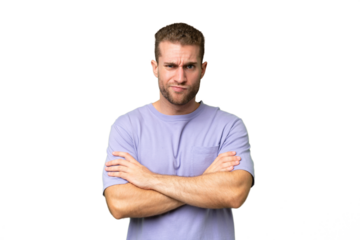 Young handsome caucasian man isolated on green chroma background feeling upset