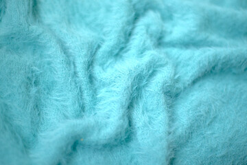 knitted fluffy blue background, blue faux fur texture