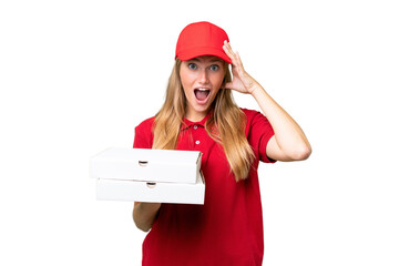 Young caucasian pizza delivery woman with work uniform picking up pizza boxes over isolated...