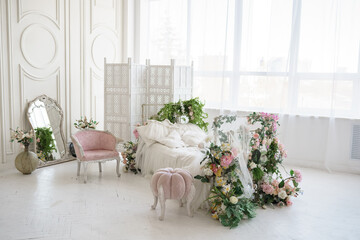 modern interior, bed decorated with spring flowers, room for princess girl