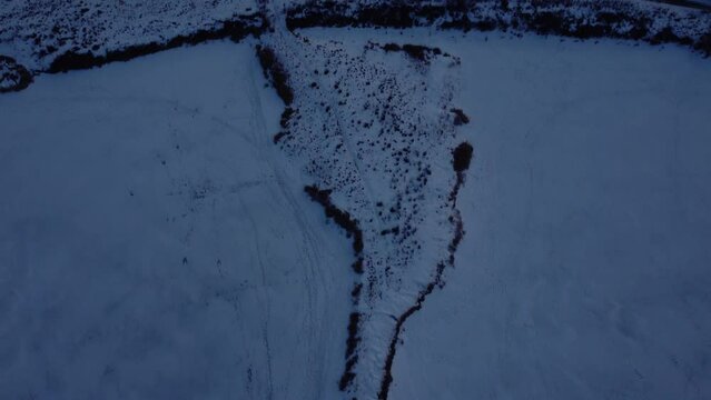 Flying drone above frosty snow-covered landscapes