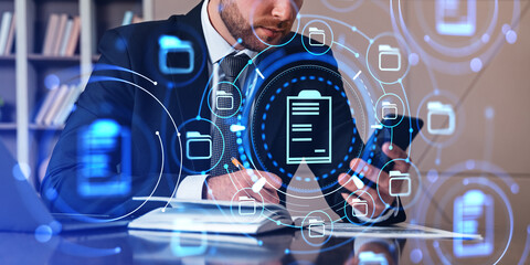 Businessman take note and using phone, document management syste