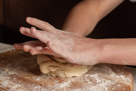 baby hands month dough on the table at home - Powered by Adobe