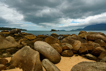 View of the rocks on the beach in a cloudy day in Ilhabela, São Paulo