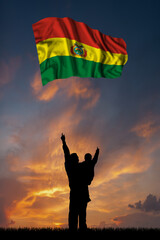 Father with son and the flag of Bolivia