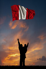 Father with son and the flag of Peru