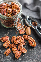 Peeled pecan nuts on kitchen table.
