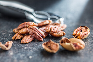 Peeled pecan nuts on kitchen table.