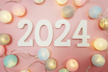Happy New Year 2024 festive background with space on pink background