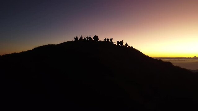 Aerial video of Mount Pulag at sunset with people in the background, the third highest mountain 