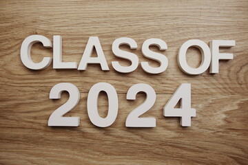 Class of 2024 alphabet letters on wooden background