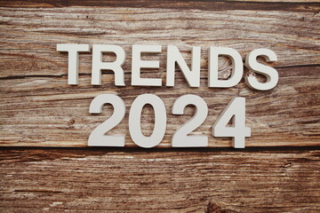 Trends 2024 alphabet letters on wooden background