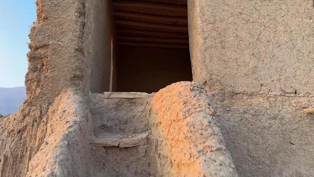 Walk up the stairs in a clay traditional mud handmade staircase stairway of a local rural house in desert town in Iran Middle east Arabia
Architectural design heritage wide view landscape people life