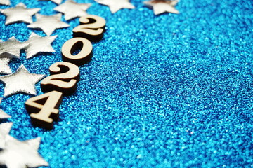 Happy New year 2024 with space copy on blue glitter background
