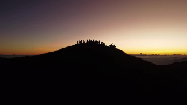 Aerial video of Mount Pulag at sunset with people in the background, the third highest mountain 