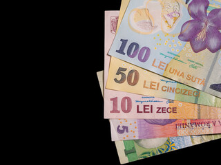 Many  romanian banknotes on black background. Romanian currency concept.