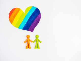 Multicoloured LGBT heart figurines . The concept of family, non-traditional relationships.