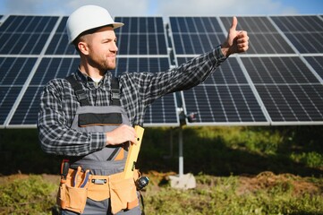 Worker installing solar panels outdoors